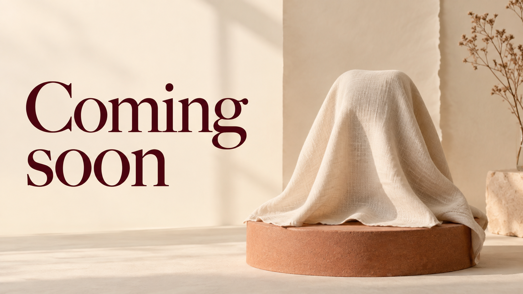 Coming soon lettering beside an ivory-covered object on a terracotta plinth